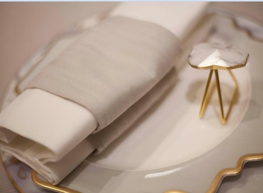 Neutral napkin folded on a plate