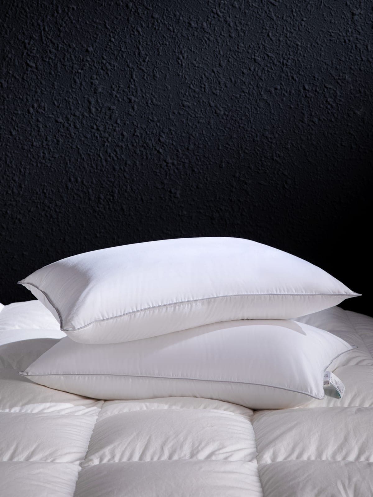White pillows arranged on a bed