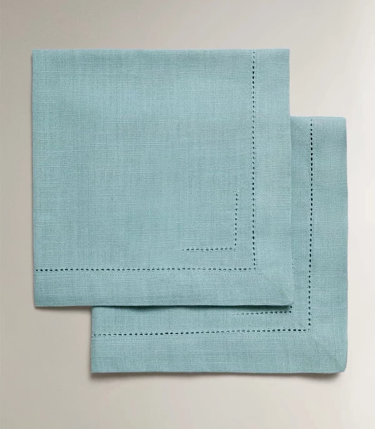 Folded grey napkin in a place setting